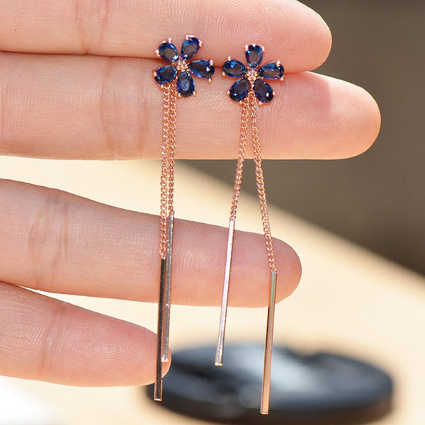 Pendientes con borlas y cadena larga con cristales de imitación azules y flores