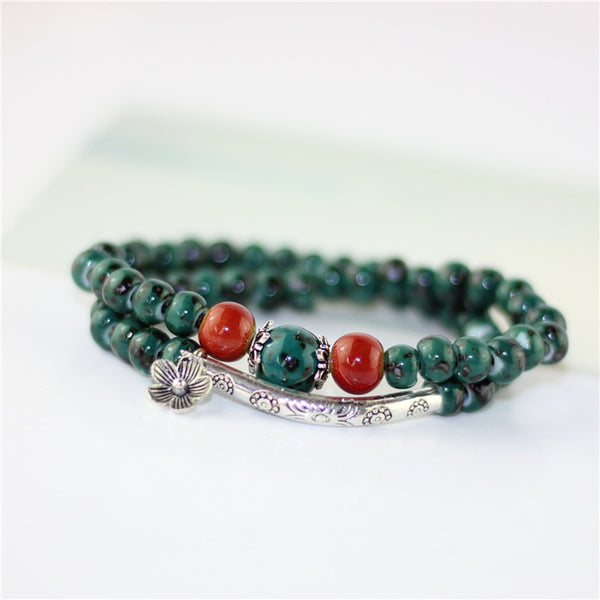 Pulseras de cerámica con dije de flor para mujer