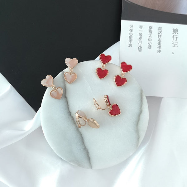 Lindos pendientes de clip de acrílico con forma de corazón doble coreano sin perforaciones