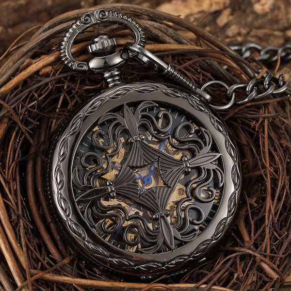 Reloj de bolsillo mecánico antiguo con esfera negra hueca