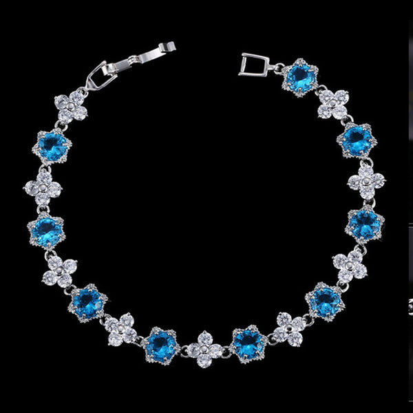 Pulseras de lujo con circonitas cúbicas azules y blancas en forma de flor de racimo de oro blanco