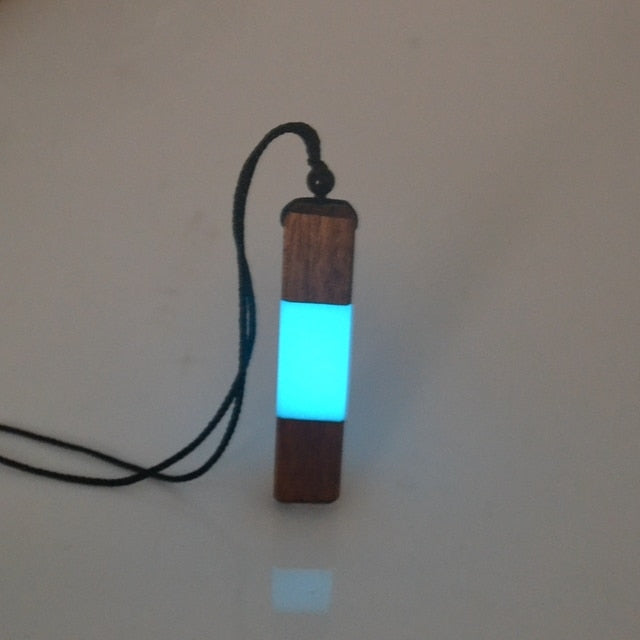 luminous necklace pendant at night
