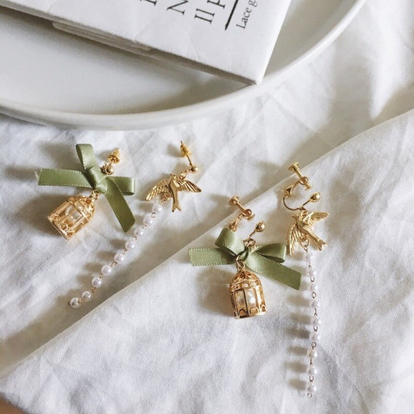 Pendientes de clip con forma de jaula de pájaro y lazo asimétrico de moda coreana