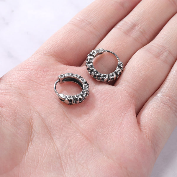 1 par de pendientes redondos de punk rock