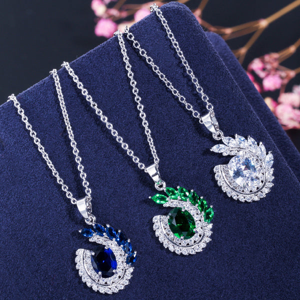 Conjunto de collar y pendientes largos colgantes de fiesta con circonita cúbica micropavé azul grande y redondo