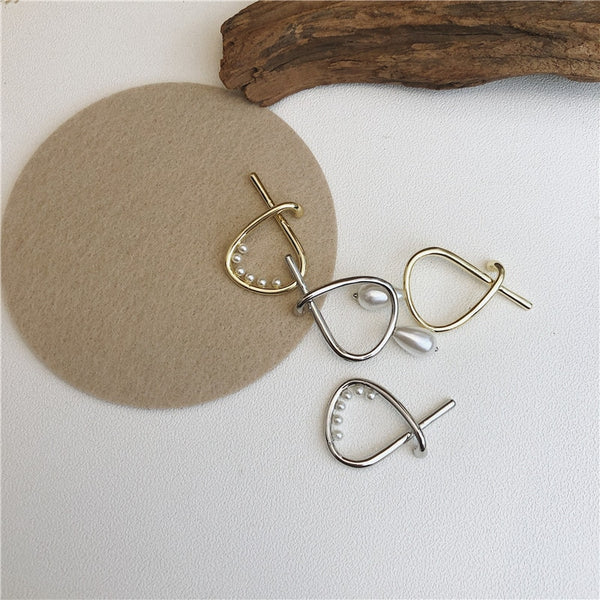 Pendientes bohemios con forma de cruz geométrica en color dorado y plateado
