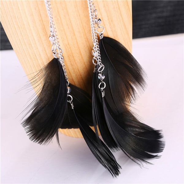 Clips con dije de lazo largo con plumas de cisne negro de Europa y América
