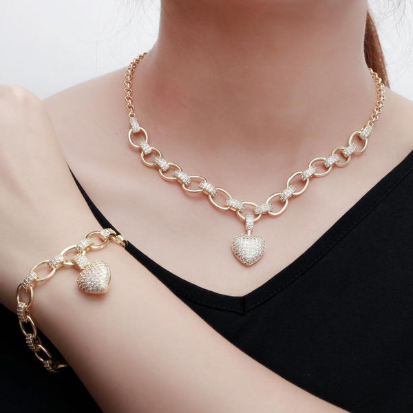 Conjunto de joyas de collar y pulsera con colgante de corazón romántico de oro
