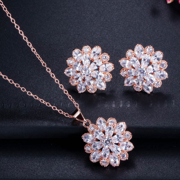 Collar y pendientes con forma de flor geométrica de circonita cúbica en color oro rosa