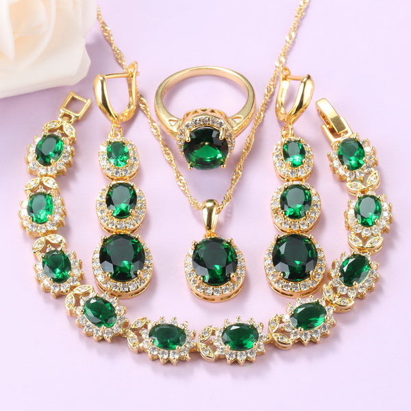 Conjunto de collar, pendientes largos, pulsera y anillo con circonitas cúbicas verdes doradas