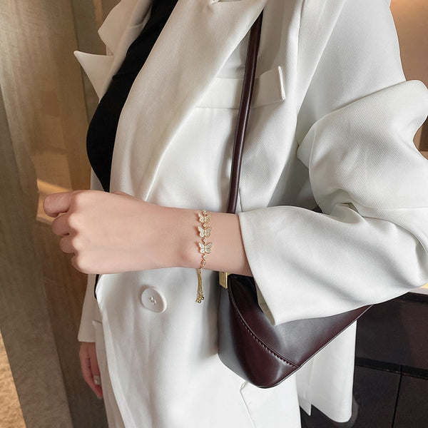 Exquisita pulsera de tres mariposas con incrustaciones de circonitas de cobre =