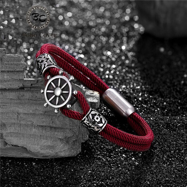 Pulseras con dijes de cuerda de timón de la marina de moda