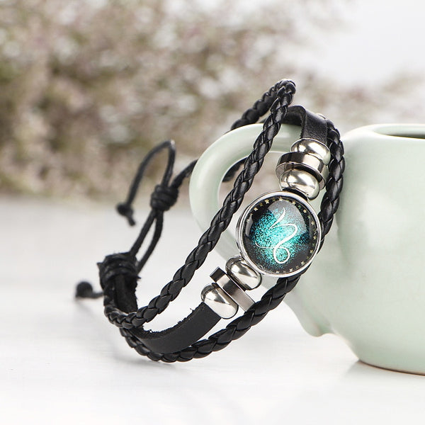Pulsera de cuero trenzado negro con los 12 signos del zodiaco