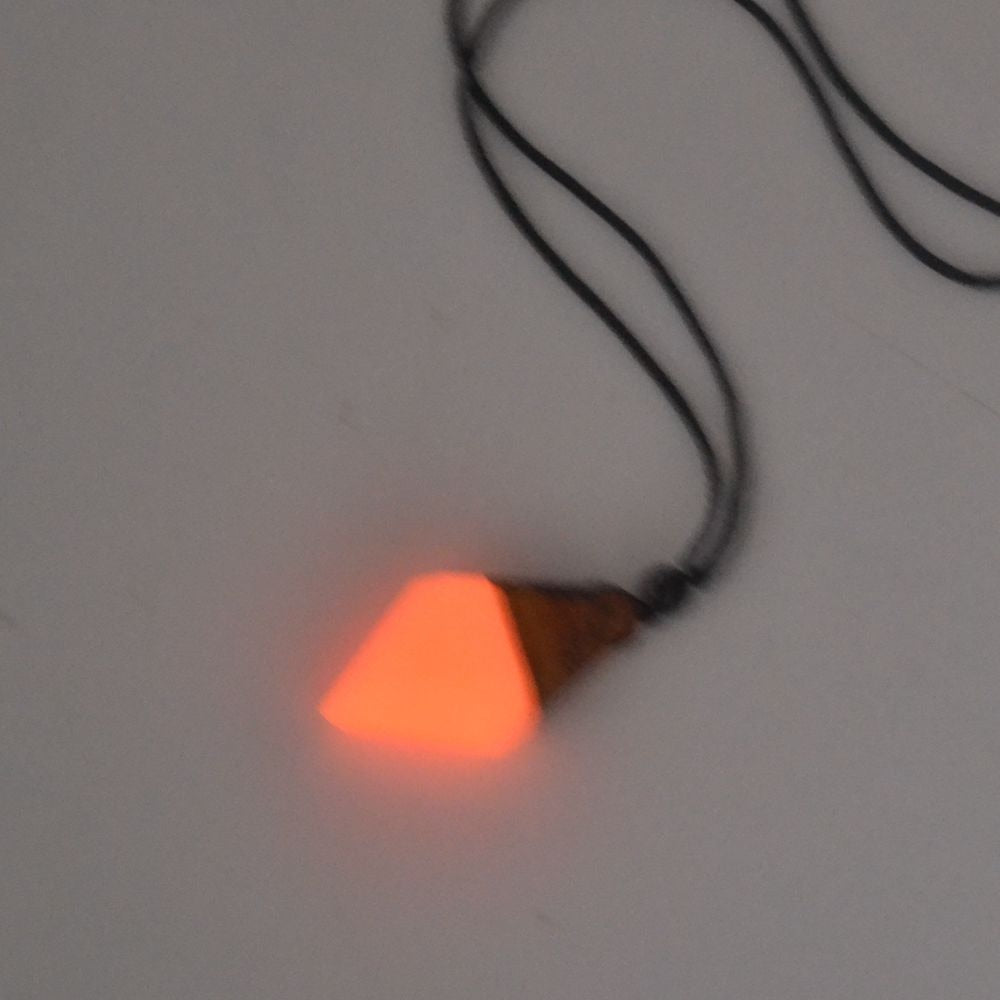 luminous necklace pendant at night