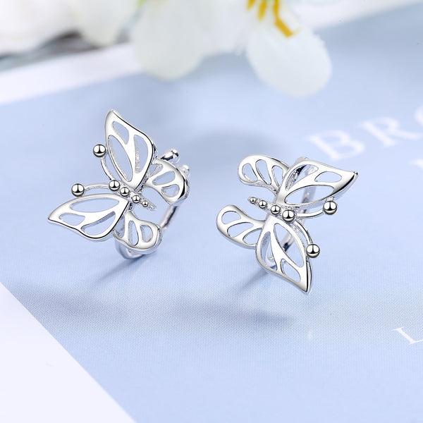 Pendientes de mariposa retro sencillos con circonitas de cristal y clip de oreja de alta calidad.