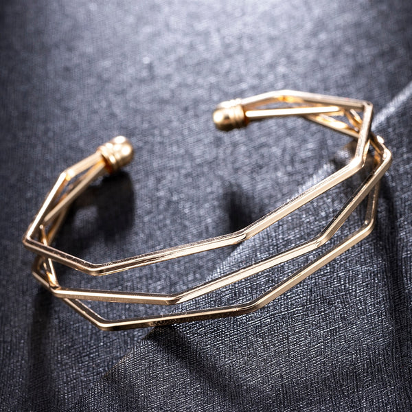 Brazalete giratorio con cadena de eslabones de flecha de aleación de metal dorado