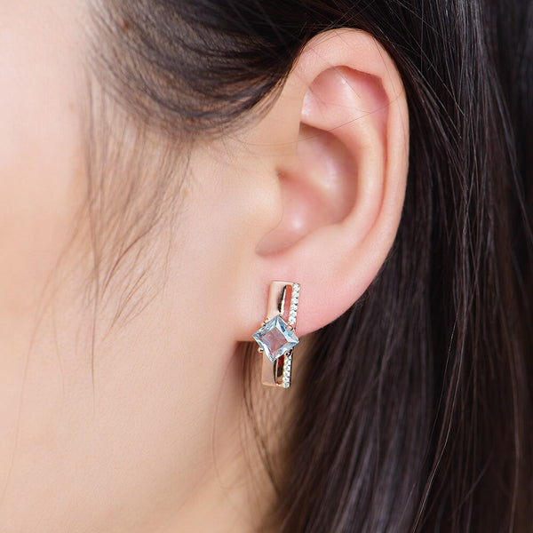 Pendientes de clip con topacio azul en oro rosa 585 para mujer