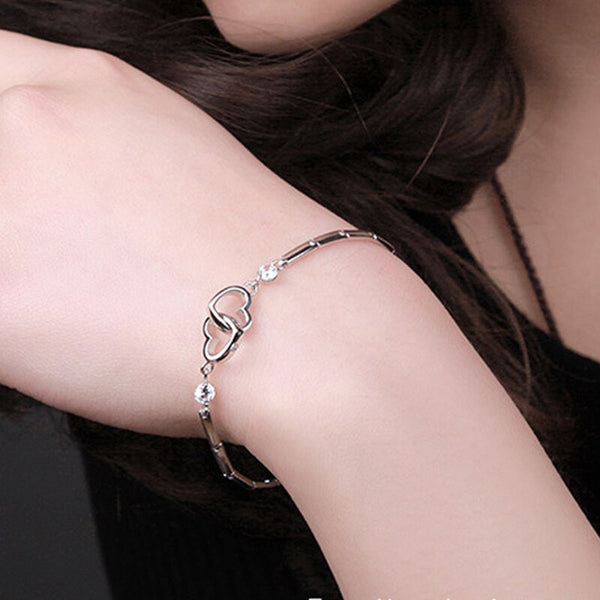 Pulsera de doble corazón con circonitas cúbicas