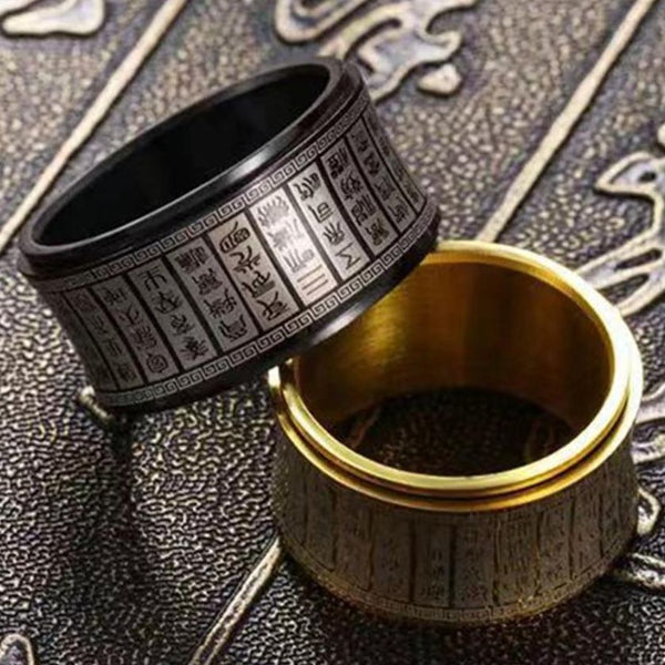 Anillo budista con cabujón giratorio y runas talladas para caballero.