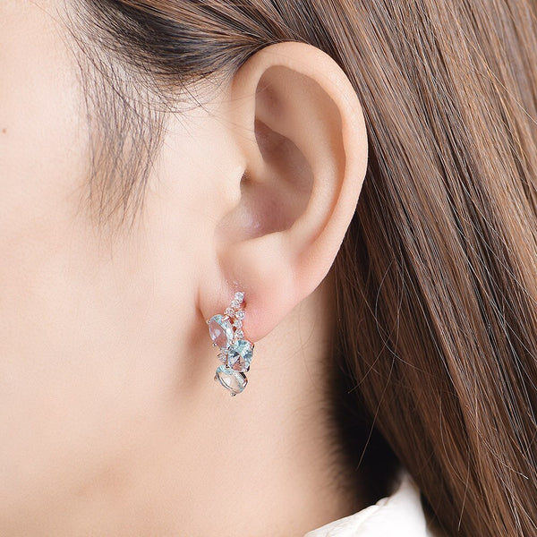 Pendientes de clip con topacio azul en oro rosa 585 para mujer