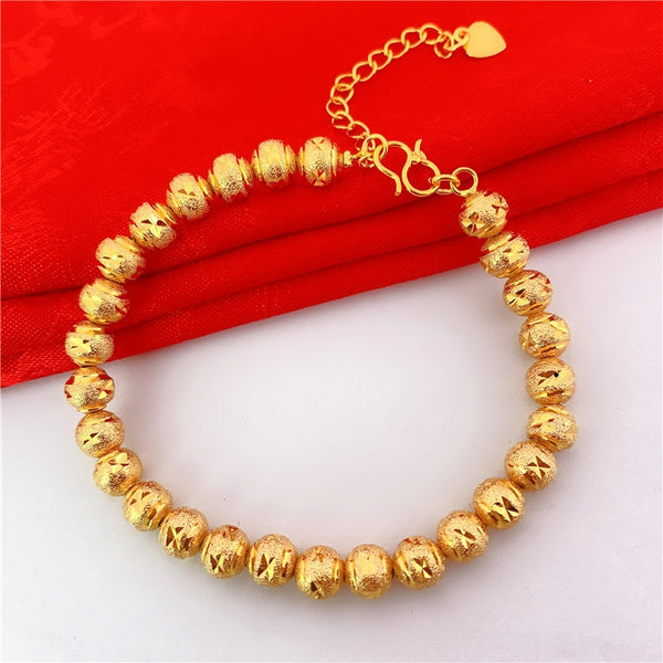 Pulsera de cuentas de arena bañadas en oro para mujer
