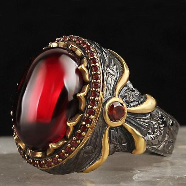 Anillo vintage de lazo con piedra roja ovalada grande y tótem bicolor