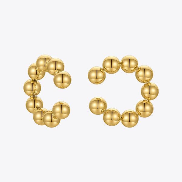 Pendientes de cuentas con forma de puño en color dorado para mujer
