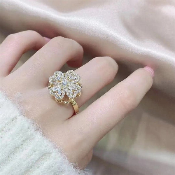 Anillo de lujo con trébol de cuatro hojas giratorio y incrustaciones de circonitas