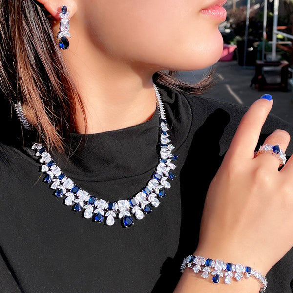Conjunto de joyería fina con collar, pulsera, pendientes y anillo de gota de agua de circonita cúbica azul real
