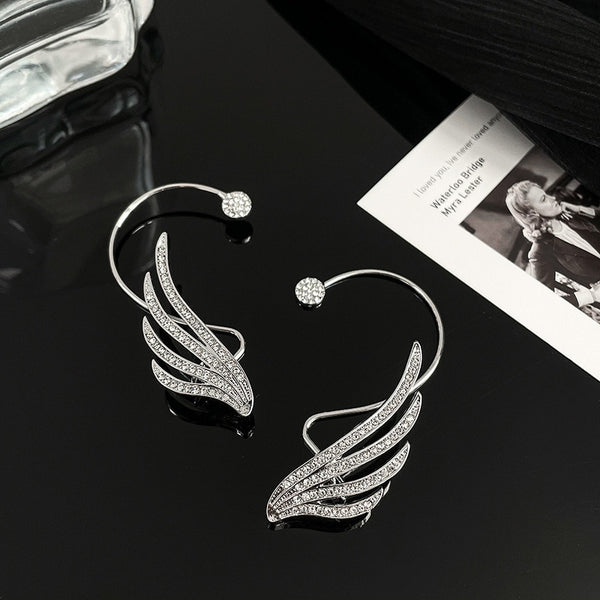Nuevos pendientes coreanos de alas de ángel con diamantes de imitación y brillantes con forma de arco para colgar en la oreja.