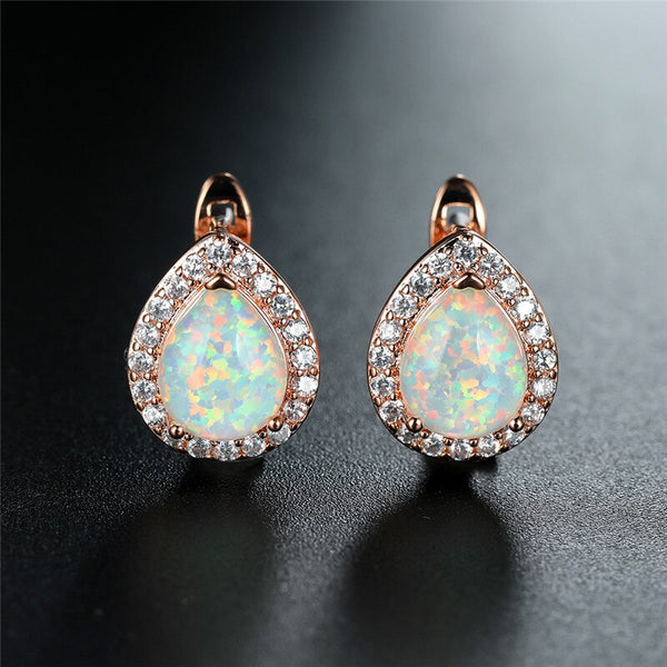 Pendientes de lujo para mujer con ópalo azul y blanco, con clip en oro rosa y plata.