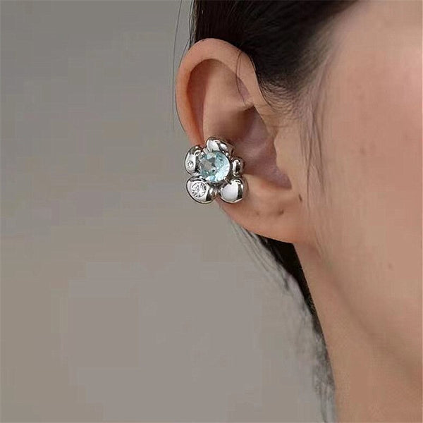 Pendientes de clip con diseño de nicho de moda coreana con flor de metal y circonita, sin perforaciones