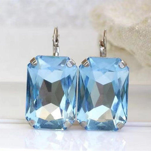 Pendientes de lujo para mujer con cristales azules claros, bonitos pendientes pequeños con clip en color plateado.
