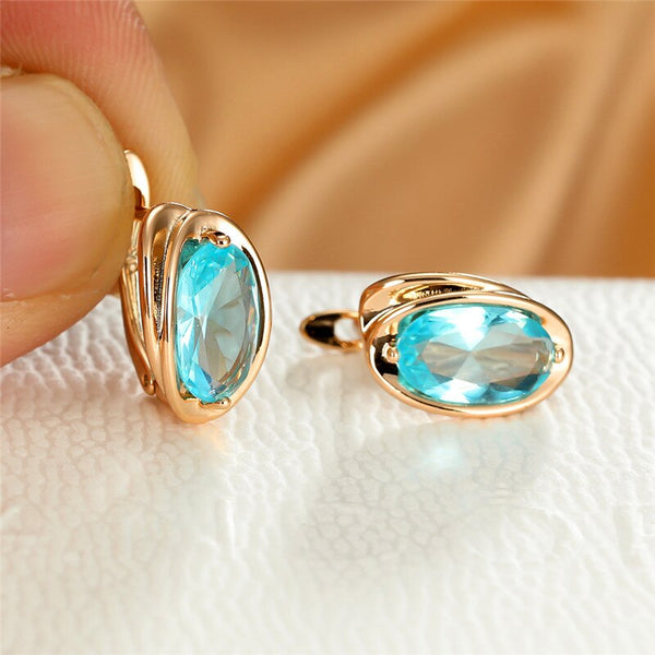 Pendientes de lujo con circonita azul aguamarina para mujer, con clip dorado.