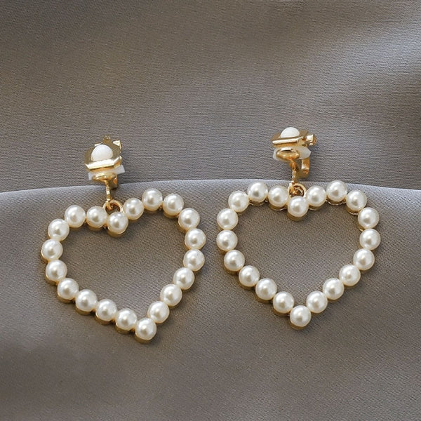 Pendientes con clip de perla creativos y encanto de moda