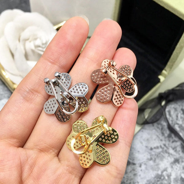 Pendientes de clip con cristales de imitación de color oro rosa y hojas y flores