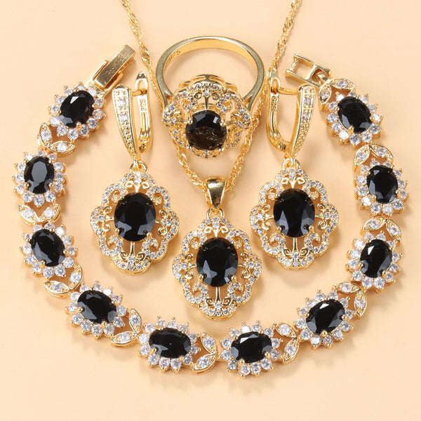 Conjunto de regalo con pendientes, collar y pulsera de circonita negra bañados en oro.