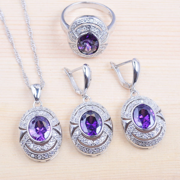 Conjunto de joyería con colgante, collar, pendientes y anillo de cristal morado