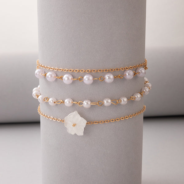 Bonita tobillera con flores blancas para mujer