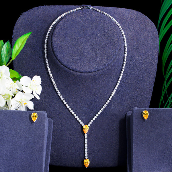 Conjunto de collar y pendientes largos con circonitas cúbicas amarillas brillantes de calidad.