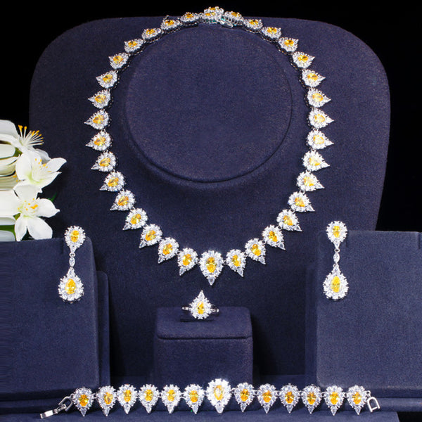 Hermoso conjunto de 4 piezas de pendientes, collar, anillo y pulsera con forma de gota de agua de circonita cúbica amarilla brillante para boda.