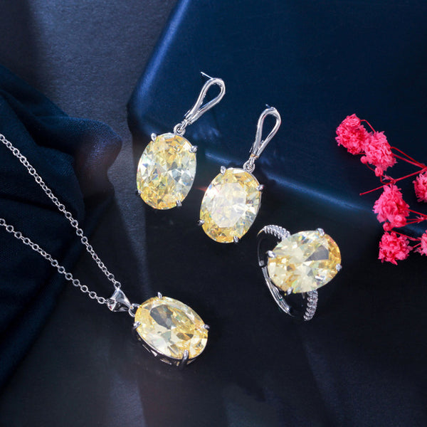 Magníficos conjuntos de collar y pendientes con colgante ovalado de cristal de circonita cúbica amarilla.