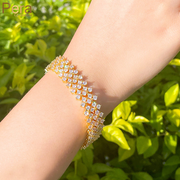 Pulseras anchas y grandes de oro amarillo con circonitas cúbicas blancas y cierre de extensión