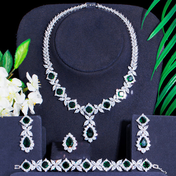 Conjunto de joyería con eslabones cuadrados en forma de hoja de cristal de circonita cúbica verde de color plateado, pulsera, anillo, collar y pendientes.