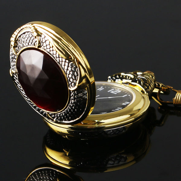 Reloj de bolsillo vintage dorado con cristales rojos y granate rojo de lujo
